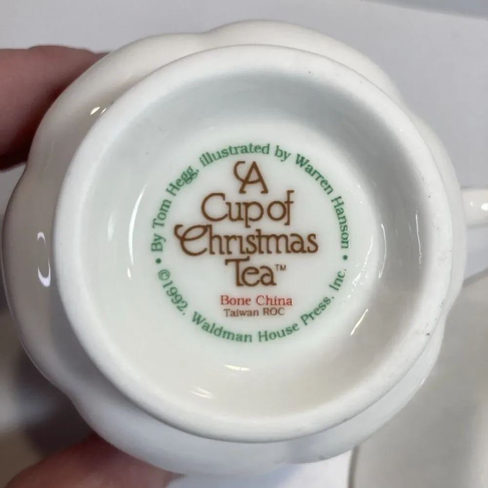 A Cup Of Christmas Tea Cup & Saucer Set Waldman House Tom Hegg Hanson Bone China